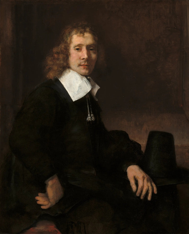 Un jeune homme assis à une table (peut-être Govaert Flinck) - Rembrandt